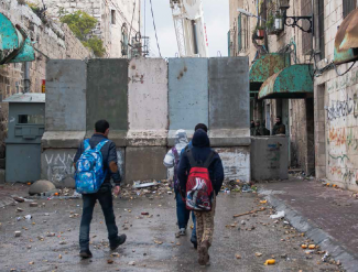 Main route into the Israeli-controlled area of Hebron City (H2), January 2016. Photo by UNICEF