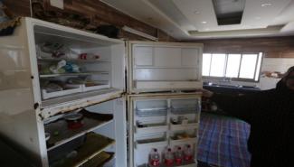 Sabreen shows her empty fridge. 3 December 2020, Gaza City. Photo by GPC