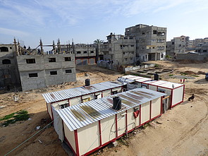 Caravans provided to displaced families and buildings under reconstruction in Shuja’iyeh neighbourhood, Gaza city, January 2016. © Photo by OCHA Caravans provided to displaced families and buildings under reconstruction in Shuja’iyeh neighbourhood, Gaza city, January 2016. © Photo by OCHA