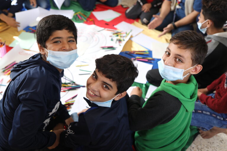 Palestinian boys at a UNICEF-supported family centre in the Gaza Strip, which offers integrated psychosocial support and protection to children affected by stress and psychosocial distress, including for children impacted by COVID-19.