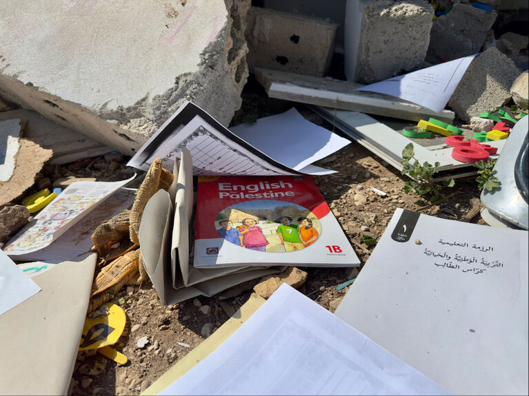 Educational materials lie scattered on the ground following the demolition of a donor-funded Palestinian school by Israeli settlers in the northern Jordan Valley. Photo by OCHA