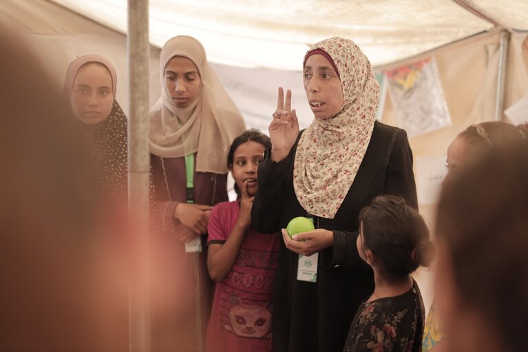 Rama facilitating an awareness-raising session in Gaza. Photo by Atfaluna