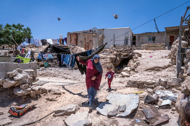 Residents of Kirbet at Tabban, one of 13 communities at risk of forcible transfer in Masafer Yatta, southern West Bank, 16 June 2022. ©Photo by OCHA Residents of Kirbet at Tabban, one of 13 communities at risk of forcible transfer in Masafer Yatta, southern West Bank, 16 June 2022. ©Photo by OCHA