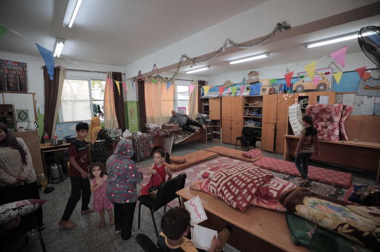 Displaced people staying in a school. Photo by UNRWA/Mohammad Hinnawi