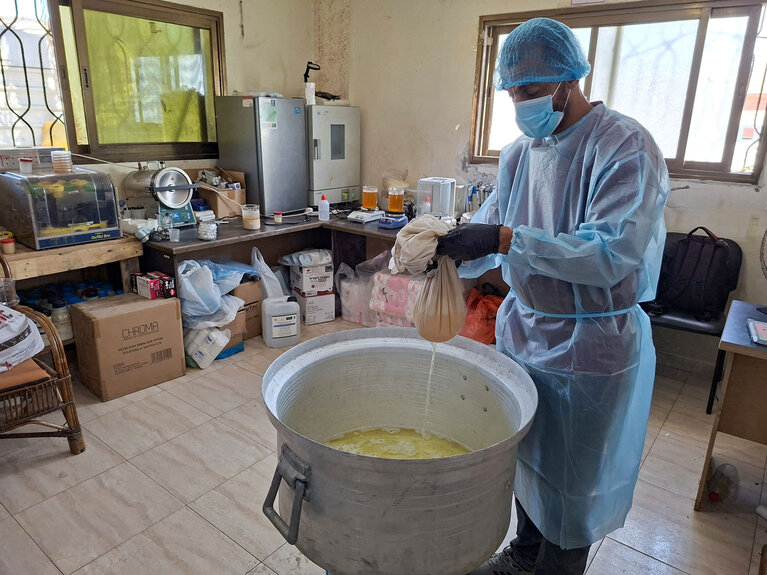 A PEF team member prepares a larvicide solution used in targeted spraying to reduce mosquito breeding in areas affected by stagnant wastewater in Gaza. Photo credit: PEF