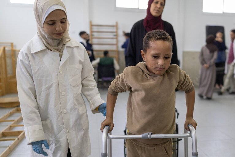 A Palestinian boy receiving rehabilitation services in northern Gaza through support from the World Health Organization and the OCHA-managed Occupied Palestinian Territory Humanitarian Fund. Photo by WHO