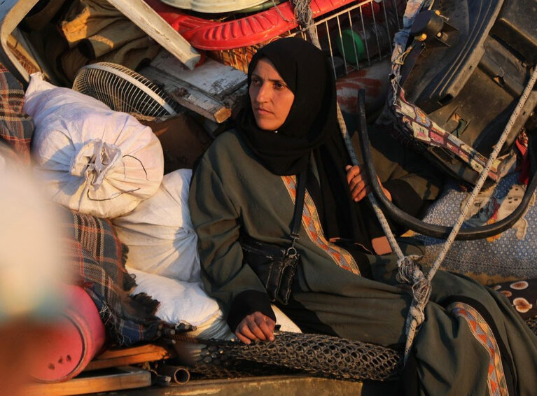 A Palestinian woman being displaced within the Gaza Strip. Photo by UNRWA