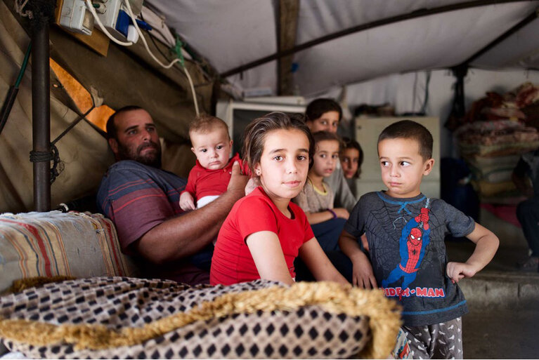  One of the families displaced from Al Ganoub in October 2023. ”We’ve been intimidated by settlers in our home many times. Since the attack against my husband, my little daughter is traumatized. Every time she hears a car passing or sees someone she doesn’t recognize; she’s scared that they might be settlers.“ Wa’ad, 26, mother of six whose husband was run over by settlers in 2021, Al Ganoub. The quote and pictures are from before the displacement. Photo by OCHA/Manal Massalha, 2022