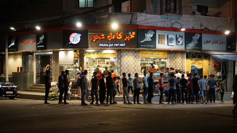 Palestinians queuing in front of a bakery in Gaza, 5 August 2022. Photo by OCHA 