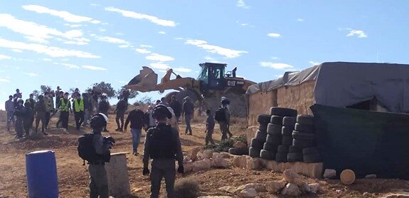 The demolishing of an unsilenced structure by Israeli forces in At Tuwani, where the Israeli authorities virtually never provide Palestinians with building permits. Photo courtesy of At Tuwani Village Council, 25 November 2020.
