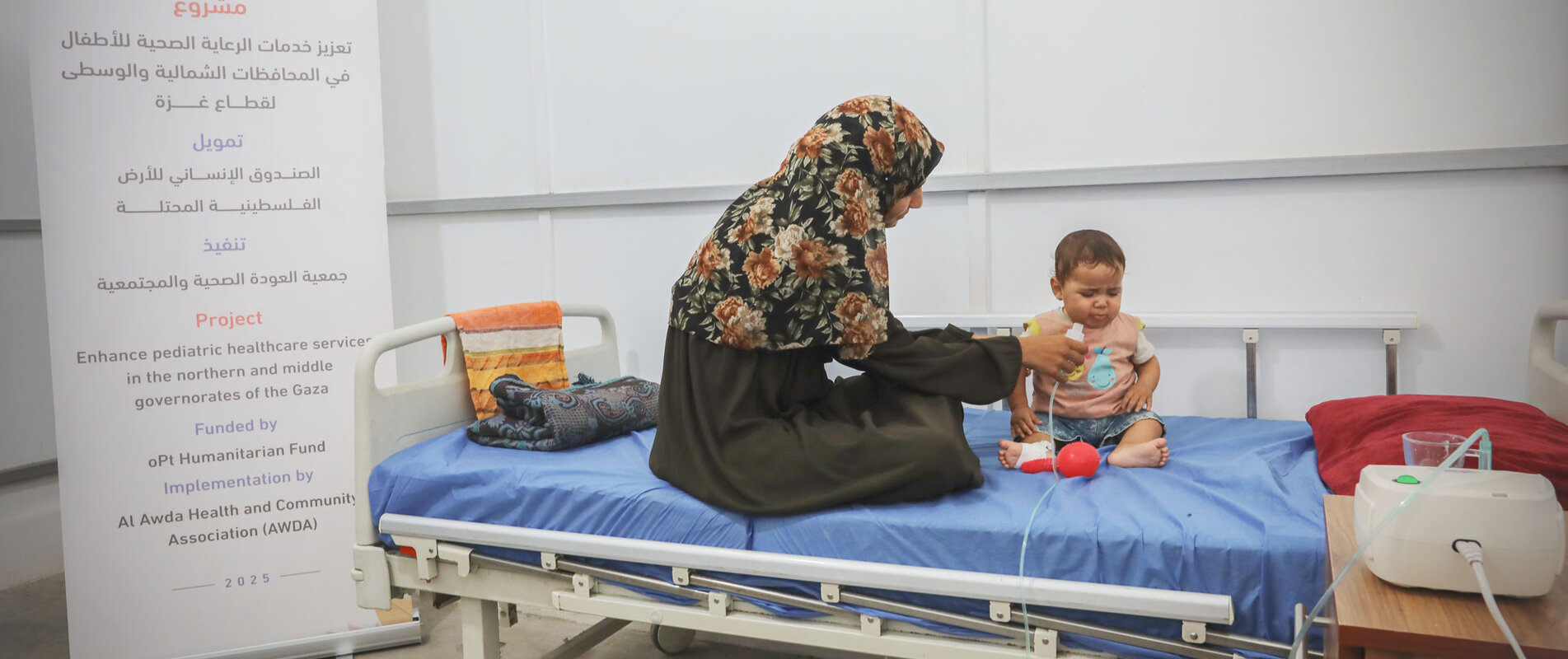 Seven-month-old Maha* with her mother in the paediatric ward of Al-Awda Hospital, North Gaza, where she received life-saving treatment, August 2024. Photo by Al-Awda