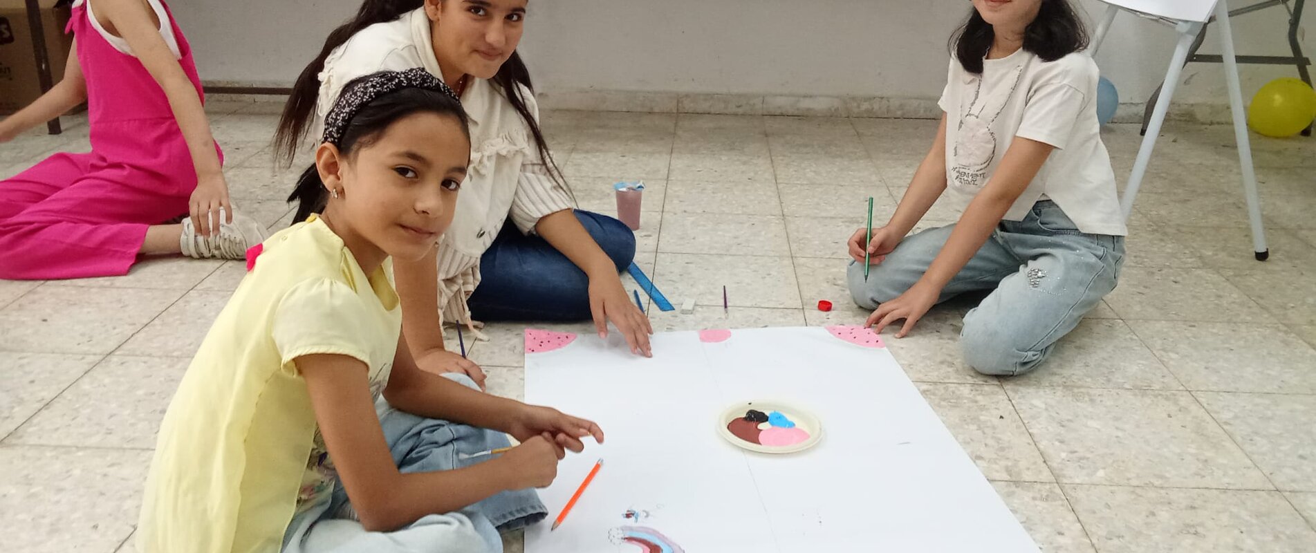 Sara engaging with her peers during a Social and Emotional Learning (SEL) and Psychosocial Support (PSS) session held in the summer of 2025. The session focused on helping children recognize, express and manage their emotions, supporting their emotional well-being and resilience.