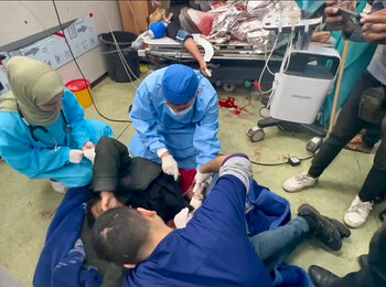 Medical team treating trauma injuries on the floor in Nasser hospital, Khan Younis. Screenshot from a video by WHO, January 2024 