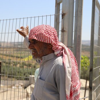 Abu Waleed, farmer and leader of the Queela community, near his house. Photo: ACF Abu Waleed, farmer and leader of the Queela community, near his house. Photo: ACF